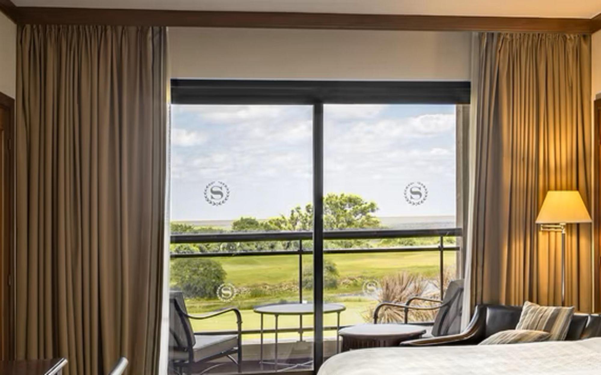 Sheraton Colonia Golf & Spa Resort Colonia del Sacramento Exterior photo A sliding window